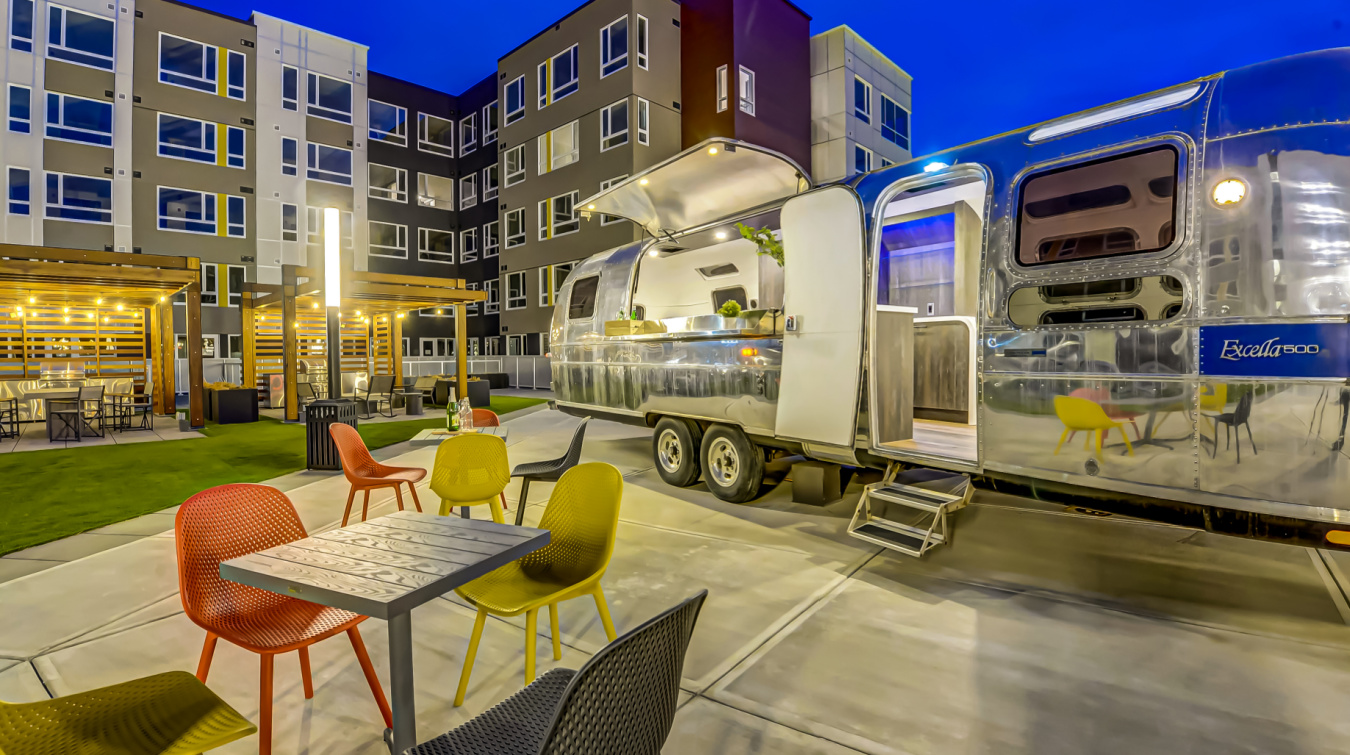 Aria-courtyard-Airstream-open-at-night-a
